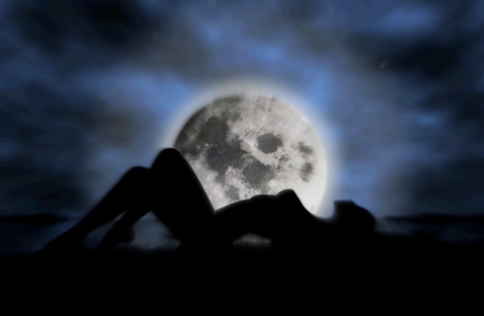 Woman laying by moon